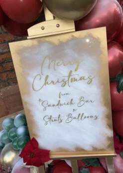 Luxe Christmas Balloon Garland With Personalised Easel Hire -Halloween Fans Shop christmas balloon garland easel hire 01