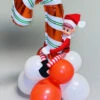 Inflated Candy Cane Mini Balloon Centrepiece With Naughty Elf